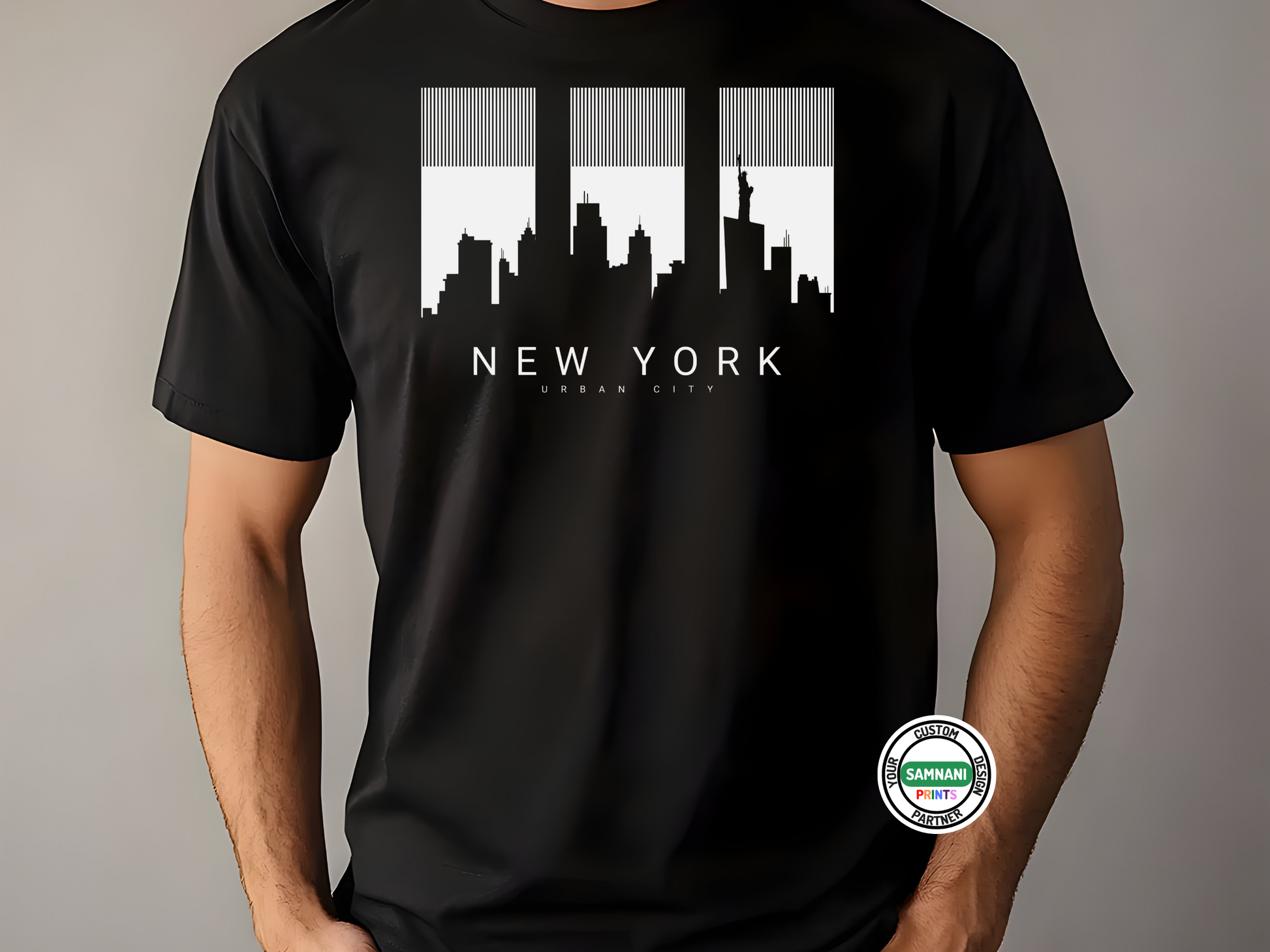 Black t-shirt with New York cityscape design on a gray background