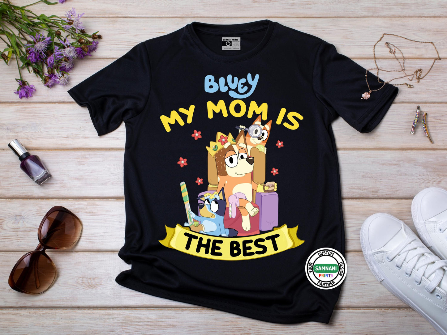 Bluey Mom Shirt Mother's Day Gift Idea β Celebrate the best mom ever with this Bluey-inspired "My Mom Is The Best" t-shirt featuring Chilli, Bluey, and Bingo. This cute and trendy black graphic tee makes a great Mother's Day gift, birthday present, or casual outfit for moms who love Bluey. Designed with comfort and durability in mind, this stylish cartoon mom shirt is a must-have for any Bluey fan who enjoys fun and unique apparel.