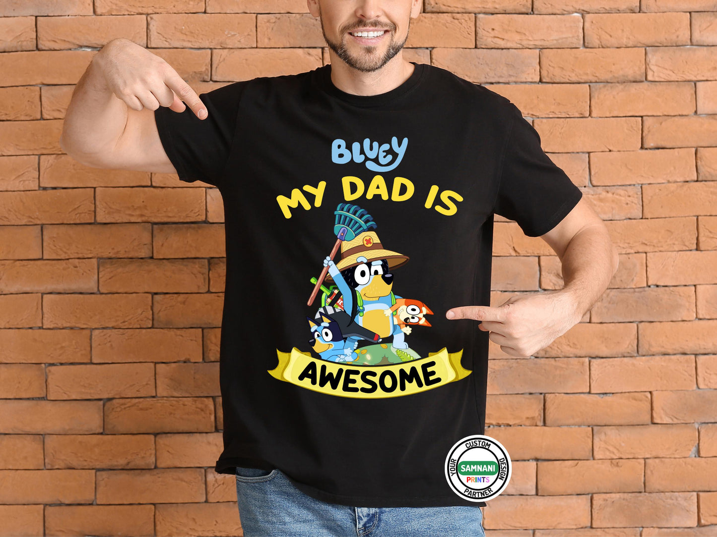 Bluey My Dad Is Awesome T-Shirt for Men – Celebrate dad with this fun Bluey-themed t-shirt featuring Bandit, Bluey, and Bingo. This high-quality black graphic tee is perfect for dads who love Bluey, making it a great Father&#39;s Day gift, birthday present, or casual wear. Designed with comfort in mind, this stylish and breathable dad t-shirt is ideal for Bluey fans who want to show off their love for the best cartoon dad in a fun and unique way.